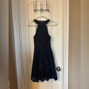 Navy Sparkly dress. Pretty design back with halter neckline. Flowy bottom.